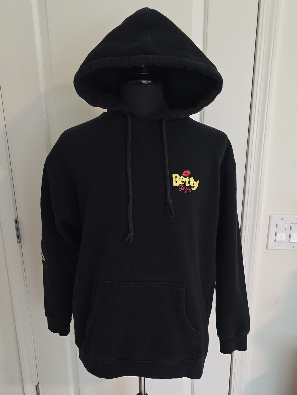 Betty Burgers Black Logo Hoodie with Yellow & Red Accent